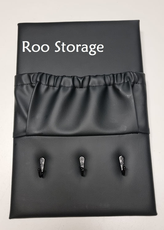 Caravan storage pocket in black vinyl, one single pocket with three hooks below